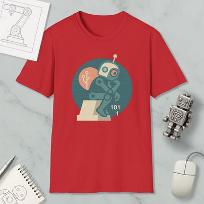 a red t-shirt with a graphic design of a robot, along with various objects such as a computer mouse, a notebook, and a pen.