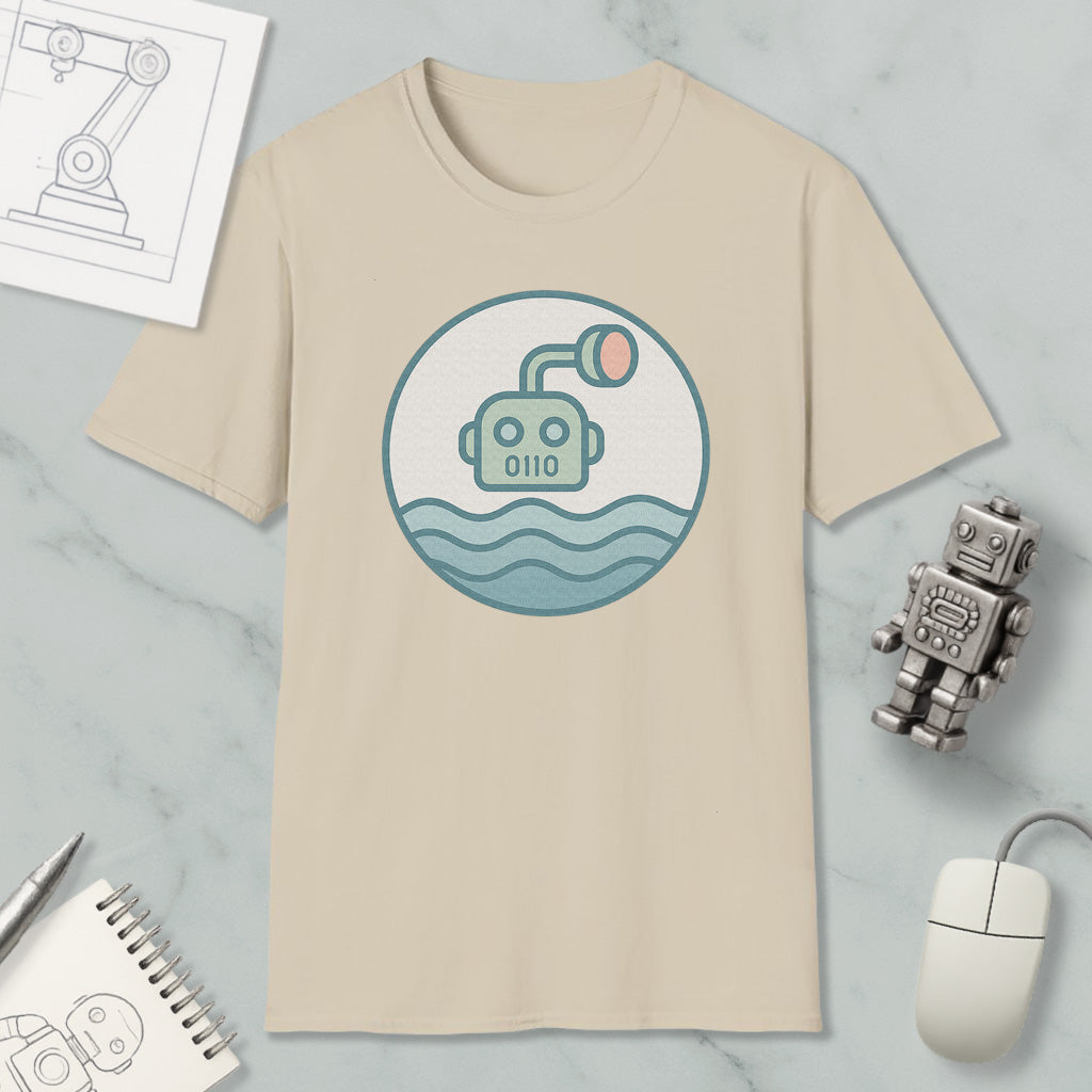 a beige t-shirt with a graphic design of a robot or submarine in the water, along with various objects such as a computer mouse, a notebook, and a pen.