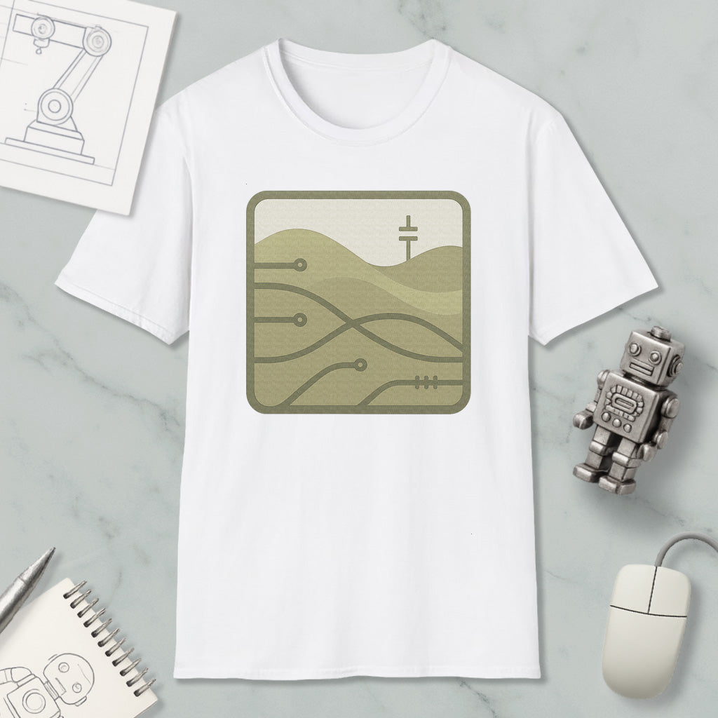 a white t-shirt with a graphic design, a small robot, a computer mouse, and some papers on a marble surface.