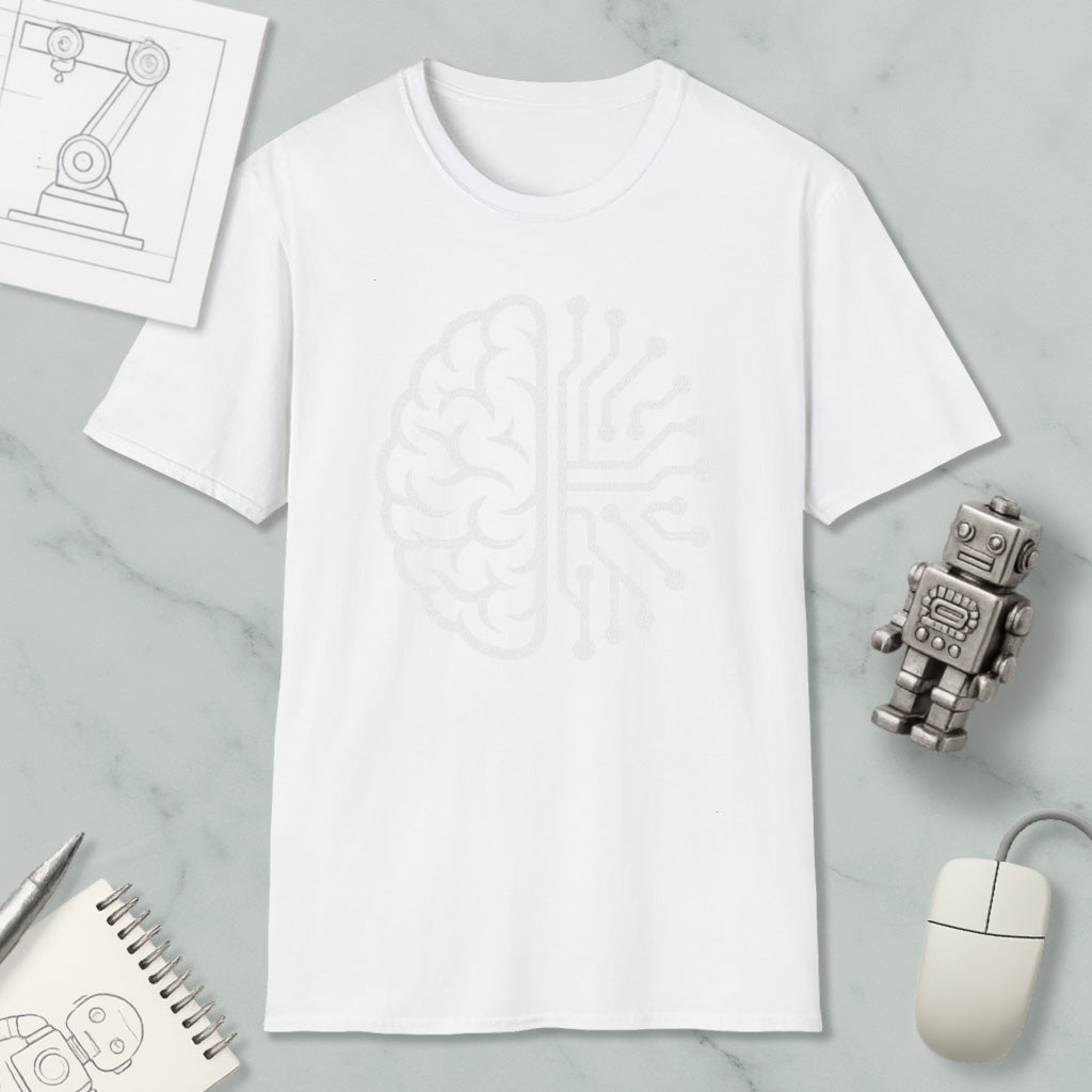 a white t-shirt with a graphic design of a brain on it, along with various objects such as a robot, a mouse, and a notebook.