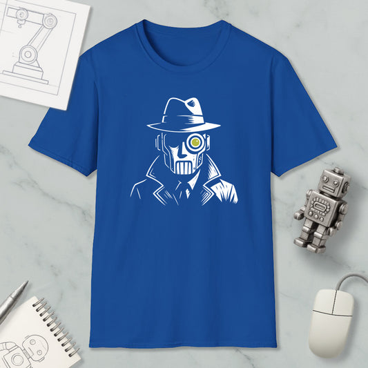 a blue t-shirt with a white graphic design depicting a man wearing a hat and a mask, along with a yellow eye patch. The t-shirt is displayed on a marble surface, accompanied by a computer mouse, a pen, and a notebook.