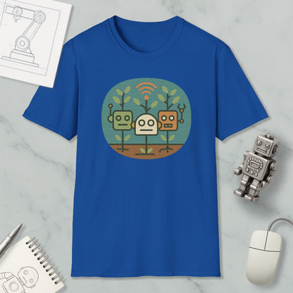 a blue t-shirt with a graphic design of three cartoon robots, along with a computer mouse, a notepad, and a pen on a marble surface.