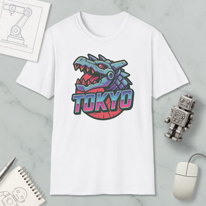 a white t-shirt with a graphic design of a dragon or monster head, along with the word "TOKYO" written below it. The t-shirt is placed on a marble surface, and there are various objects around it, including a computer mouse, a notebook, and a robot.