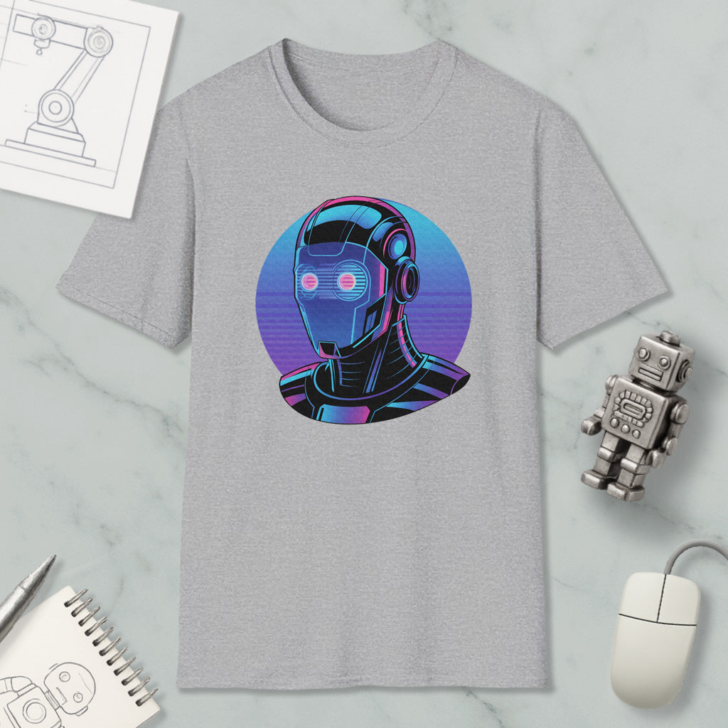 a gray t-shirt with a graphic design of a robot or cyborg-like figure, surrounded by various objects such as a computer mouse, a pen, and a notebook.