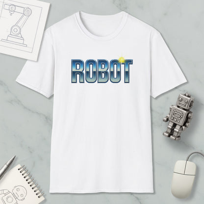 a white t-shirt with the word "ROBOT" printed on it, along with a small robot figurine and some other items such as a computer mouse and a notebook.