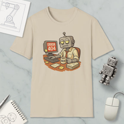 a t-shirt with a cartoon robot sitting at a desk, working on a computer, and displaying an error message that reads " Error 404". The t-shirt is surrounded by various objects, including a mouse, a keyboard, and a robot figurine.