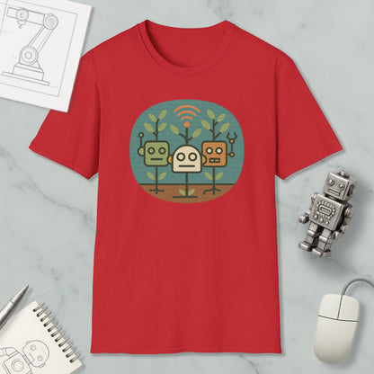 a red t-shirt with a graphic design of three cartoon robots, along with a computer mouse, a notebook, and a pen on a marble surface.