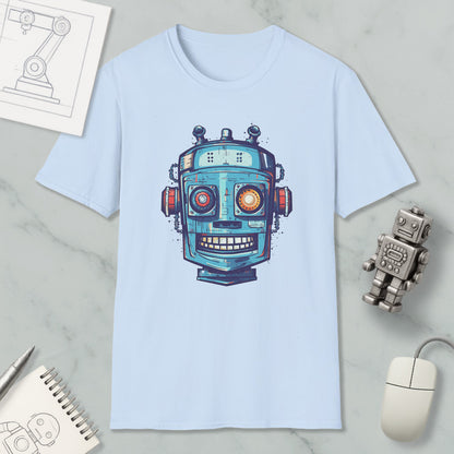 a light blue t-shirt with a colorful robot graphic printed on it, along with various objects such as a computer mouse, a notebook, and a pen.