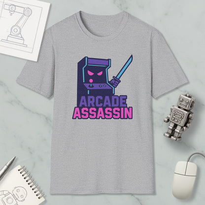 a gray t-shirt with a graphic design depicting a arcade cabinet character holding a sword, accompanied by the text "ARCADE ASSASSIN".