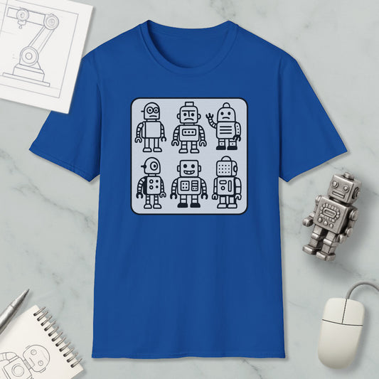 a blue t-shirt with a graphic design of six cartoon-style robots, along with a computer mouse and a notebook on a marble surface.