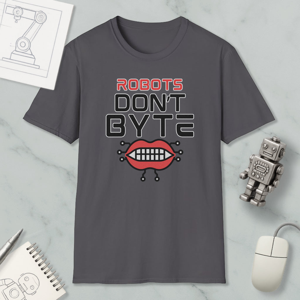 a gray t-shirt with a graphic design that says "ROBOTS DON'T BYTE" and includes a robot's mouth with teeth. The t-shirt is displayed on a marble surface, along with a computer mouse, a notepad, and a pen.