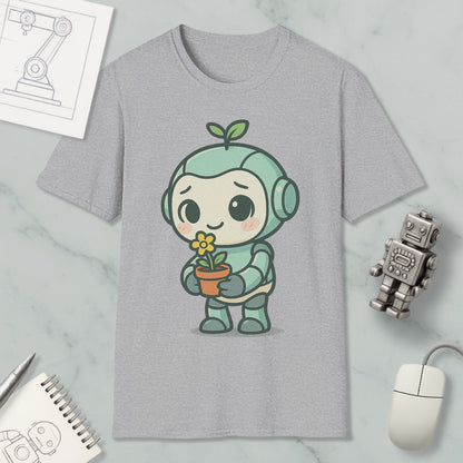 a gray t-shirt with a cartoon robot holding a flower, surrounded by various objects such as a computer mouse, a notebook, and a robot figurine.