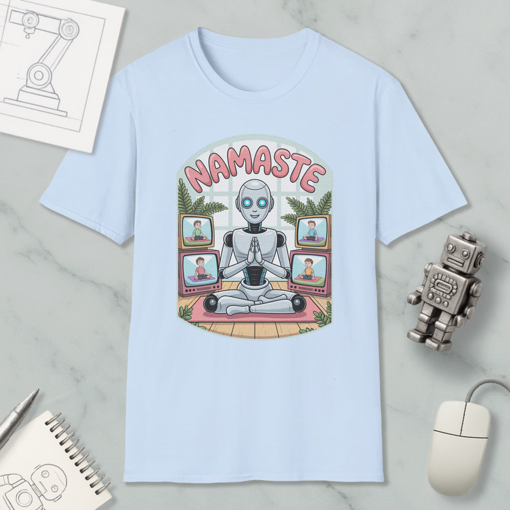A light blue t-shirt with a graphic design depicting a robot sitting in a meditative pose surrounded by various images of people on laptops.