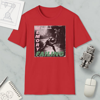 a red t-shirt with a graphic design depicting a person in a robot-like pose, accompanied by the text "The crash memory failing".