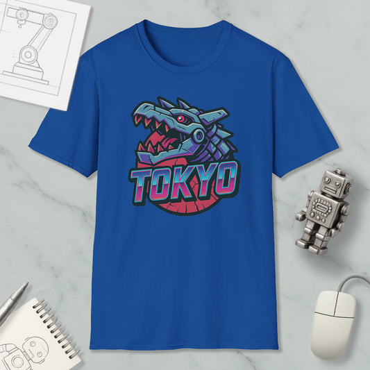 a blue t-shirt with a graphic of a dragon or monster head and the word "TOKYO" written on it, along with some other items such as a computer mouse, a notebook, and a robot figure.