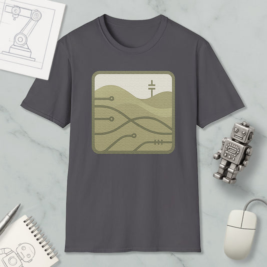 a gray t-shirt with a graphic design, a small robot, a computer mouse, and a notebook on a marble surface.
