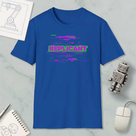 a blue t-shirt with a graphic design, a computer mouse, a notebook, and a small robot figurine.