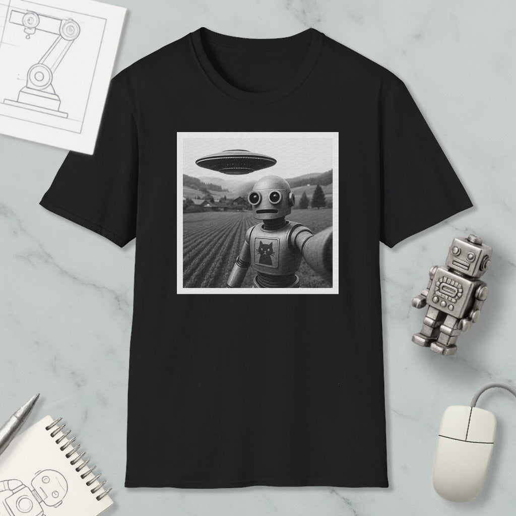 a black and white photograph of a robot with a large spaceship hovering above it, set against a field. Surrounding the photograph are various objects, including a notebook, a mouse, and a small robot figurine.